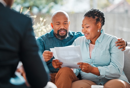 couple going over documents with a lawyer
