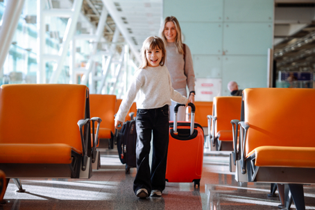 mother and daughter in an airport